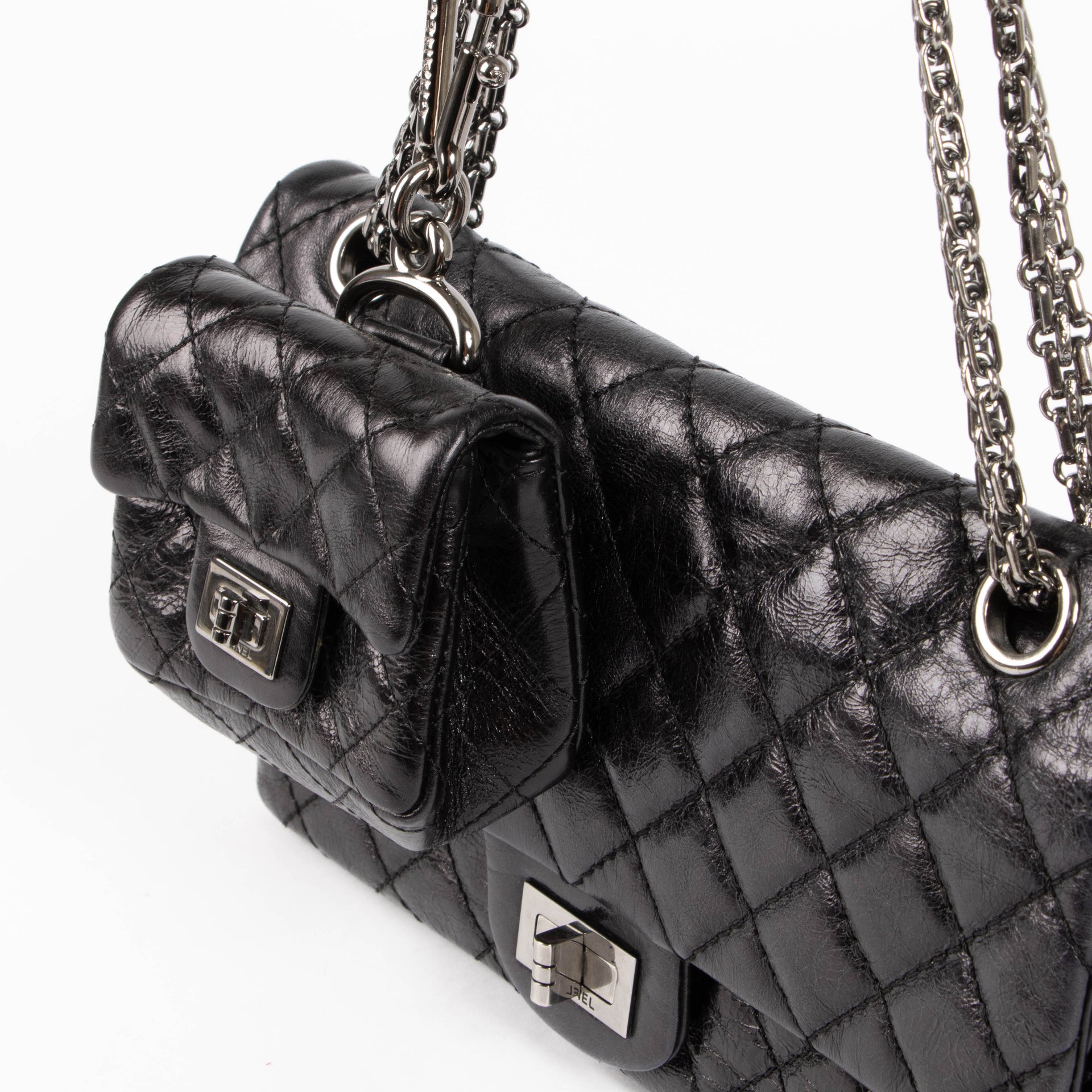 Shop this authentic Chanel Black Aged Calfskin Medium 2.55 Reissue Bag with Micro Pouch pre-loved on Labellov.com 