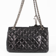 Shop this authentic Chanel Black Aged Calfskin Medium 2.55 Reissue Bag with Micro Pouch pre-loved on Labellov.com 