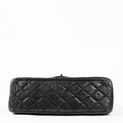 Shop this authentic Chanel Black Aged Calfskin Medium 2.55 Reissue Bag with Micro Pouch pre-loved on Labellov.com 