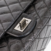 Shop this authentic Chanel Black Aged Calfskin Medium 2.55 Reissue Bag with Micro Pouch pre-loved on Labellov.com 