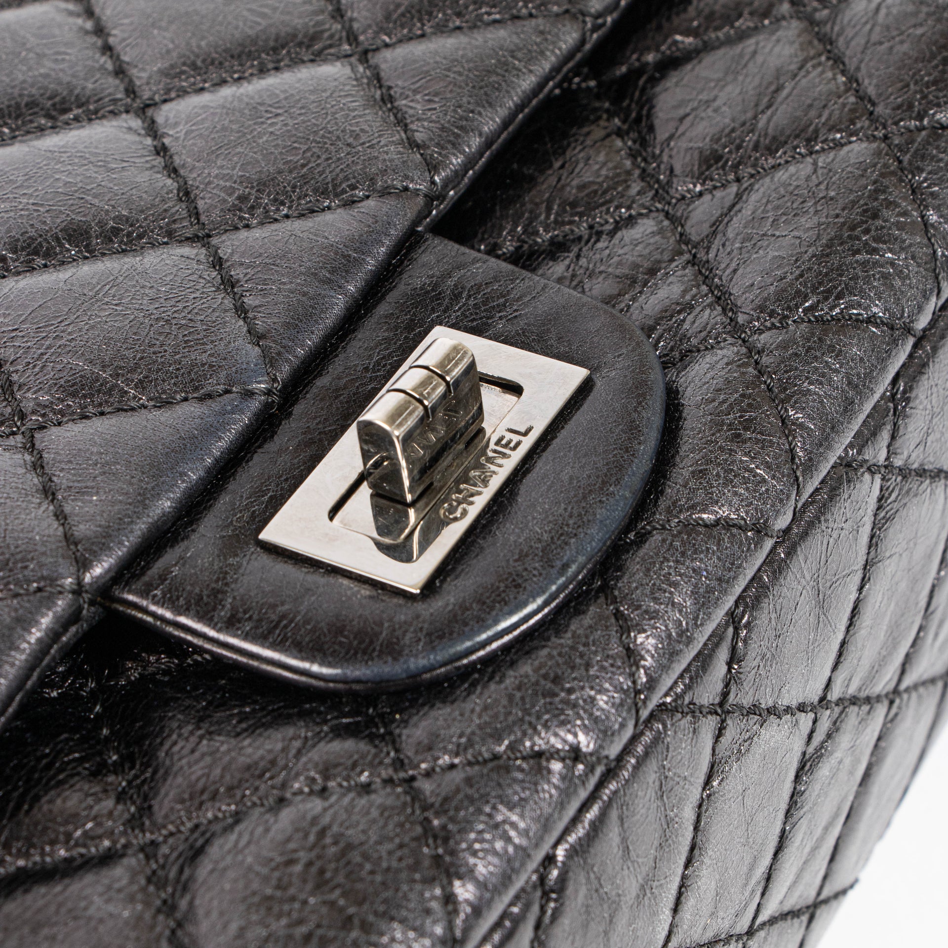 Shop this authentic Chanel Black Aged Calfskin Medium 2.55 Reissue Bag with Micro Pouch pre-loved on Labellov.com 