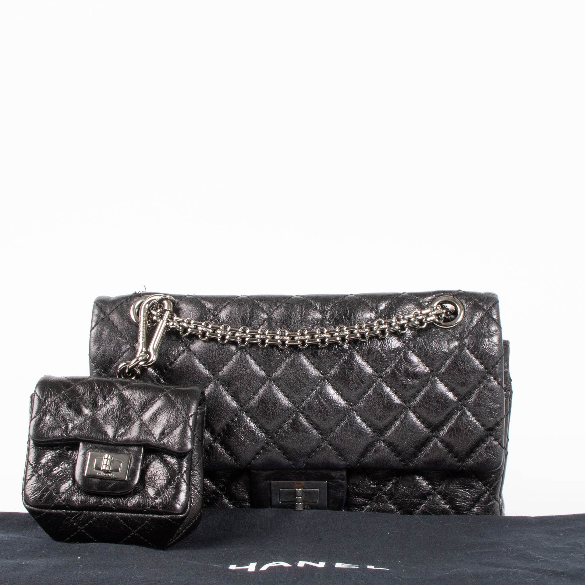 Shop this authentic Chanel Black Aged Calfskin Medium 2.55 Reissue Bag with Micro Pouch pre-loved on Labellov.com 