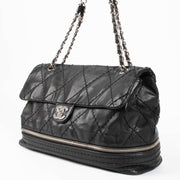 Shop this authentic Chanel Black Stitched Expandable Shoulder Bag pre-loved on Labellov.com 