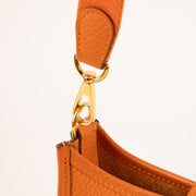 Shop this authentic Hermès Evelyne 16 Orange Clemence GHW pre-loved on Labellov.com