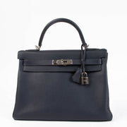 Shop the authentic Hermes Kelly 32 Bleu Nuit PHW second hand on Labellov.com