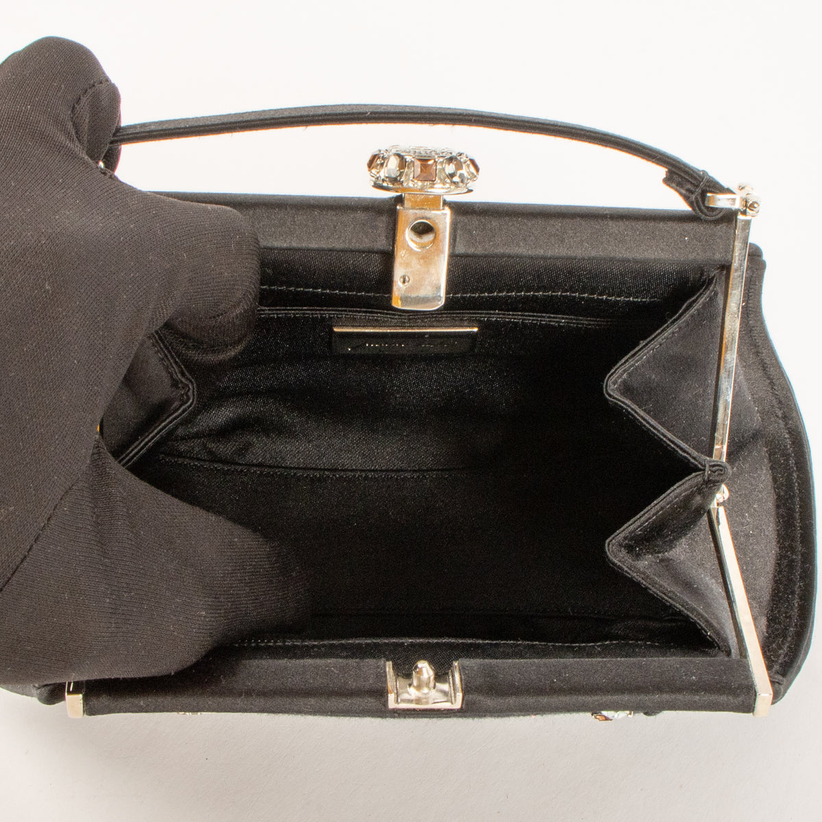 Shop this authentic Judith Leiber Black Satin Frame Clutch pre-loved on Labellov.com