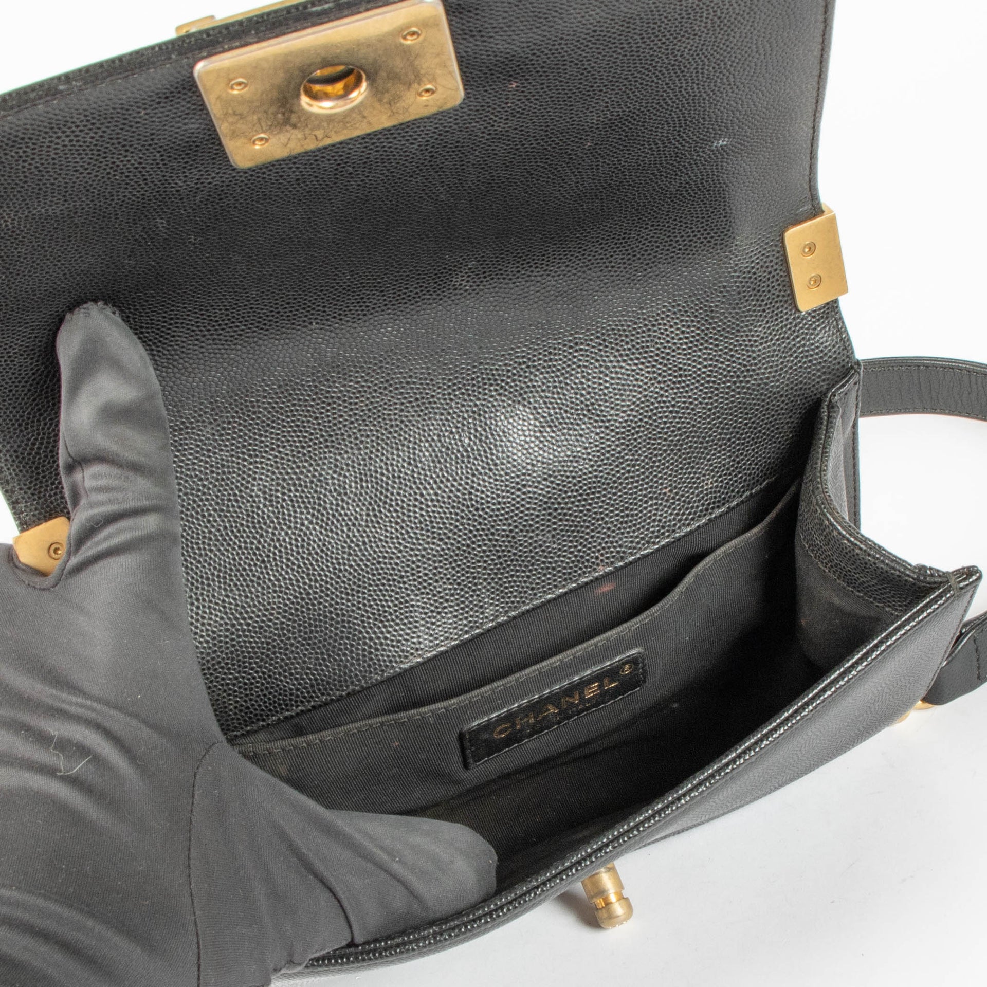 Shop this 100% authentic Chanel Black Caviar Small Boy Chanel Bag at Labellov.com