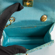 Shop this authentic Chanel 1980s Blue Sequin Micro Flap Bag pre-loved on Labellov.com