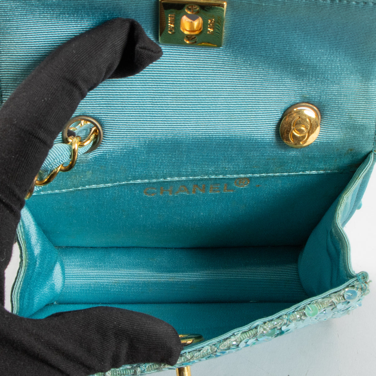 Shop this authentic Chanel 1980s Blue Sequin Micro Flap Bag pre-loved on Labellov.com