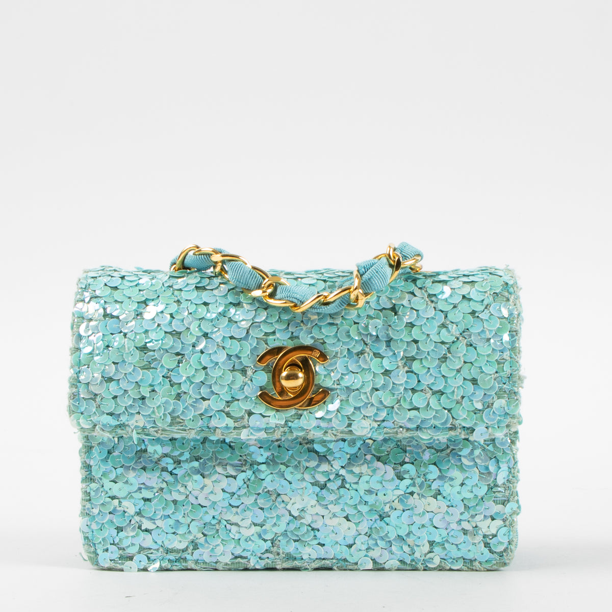 Shop this authentic Chanel 1980s Blue Sequin Micro Flap Bag pre-loved on Labellov.com
