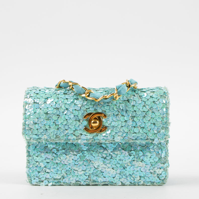 Shop this authentic Chanel 1980s Blue Sequin Micro Flap Bag pre-loved on Labellov.com