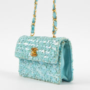 Shop this authentic Chanel 1980s Blue Sequin Micro Flap Bag pre-loved on Labellov.com