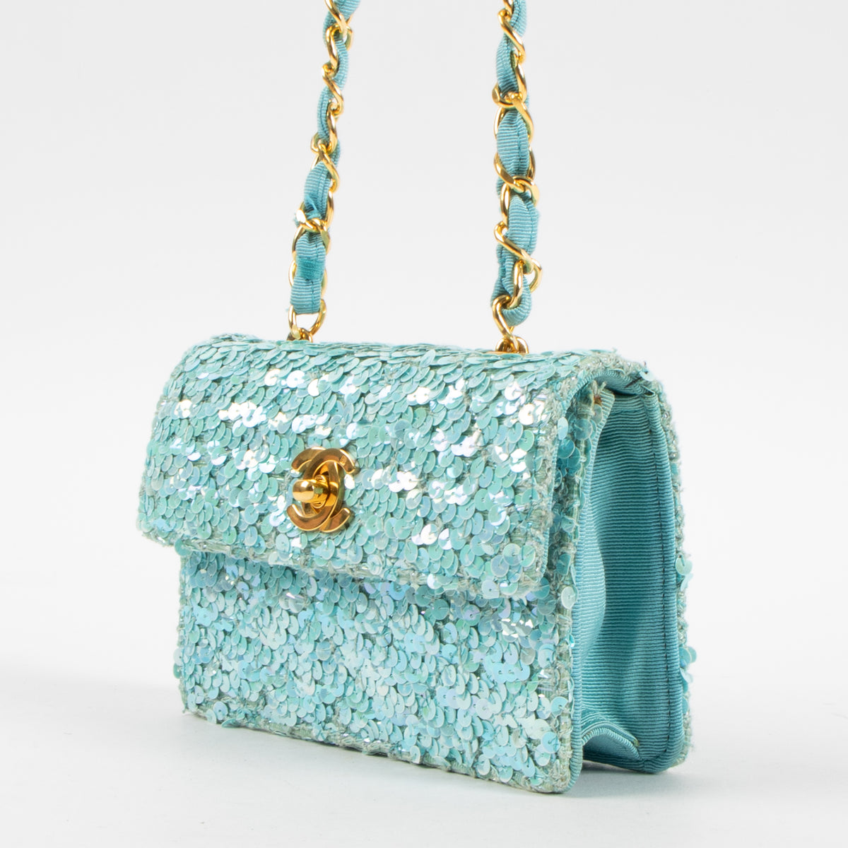 Shop this authentic Chanel 1980s Blue Sequin Micro Flap Bag pre-loved on Labellov.com
