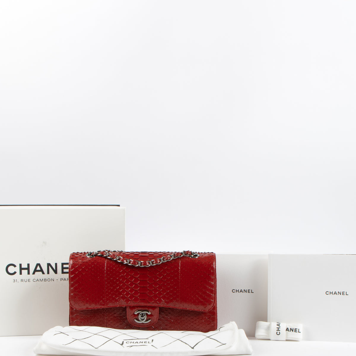 Shop this authentic luxury Chanel Red Python Medium Classic 11.12 bag Pre-Loved on Labellov.com
