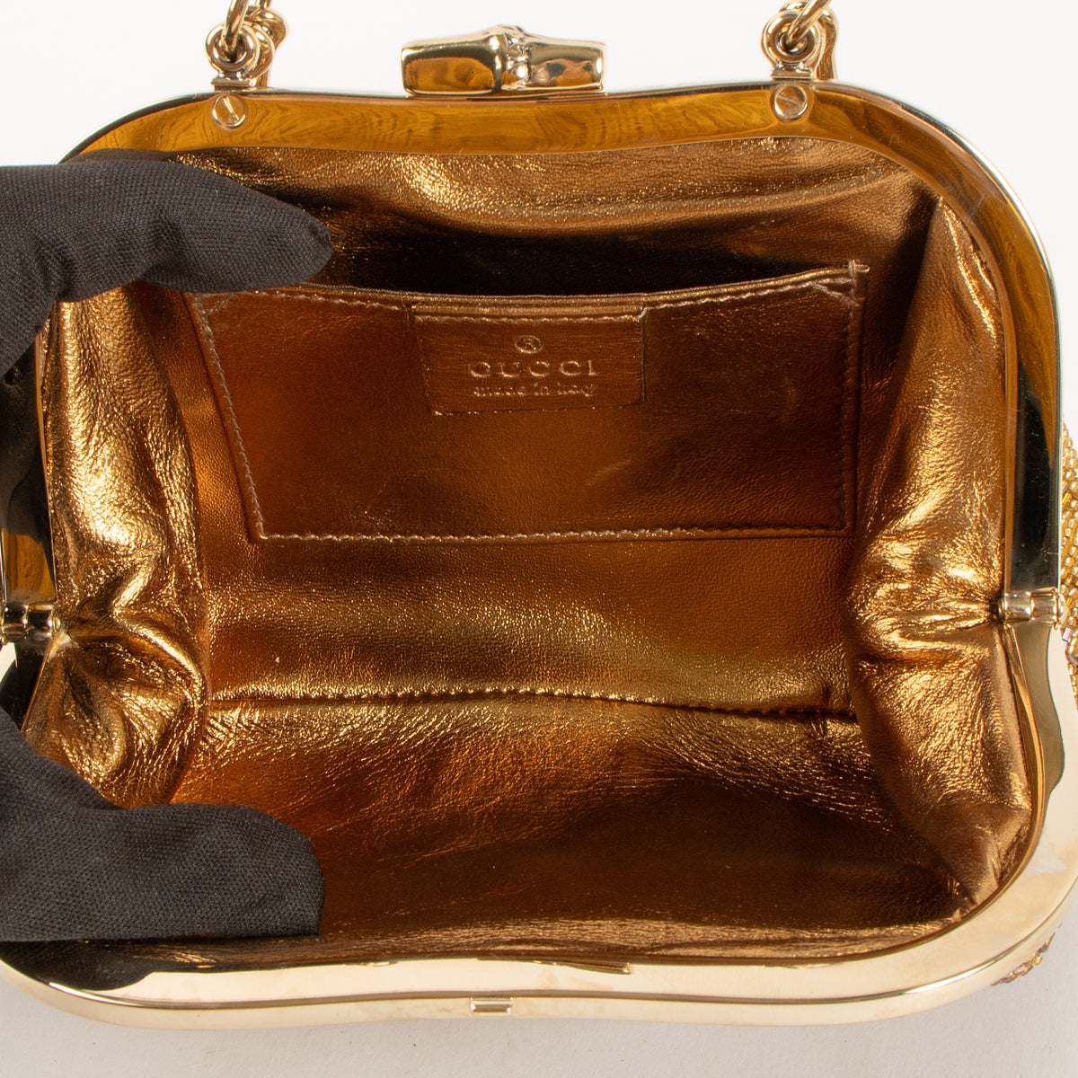 Shop this authentic Gucci Gold Beaded GG Frame Clutch pre-loved on Labellov.com