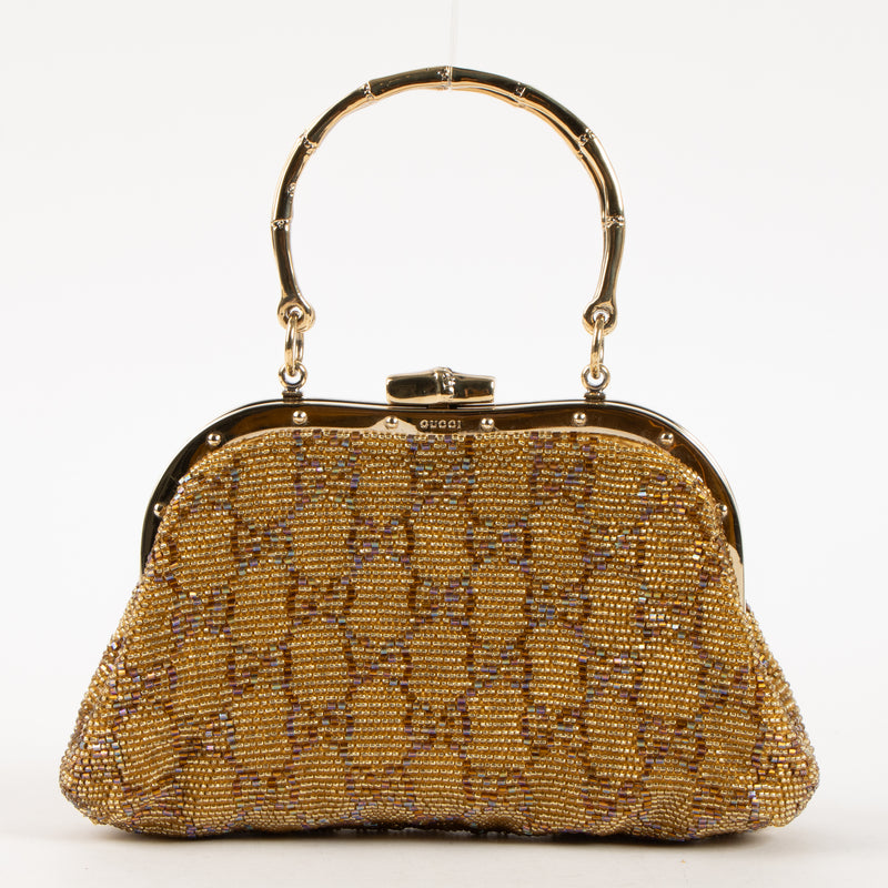 Shop this authentic Gucci Gold Beaded GG Frame Clutch pre-loved on Labellov.com