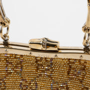 Shop this authentic Gucci Gold Beaded GG Frame Clutch pre-loved on Labellov.com