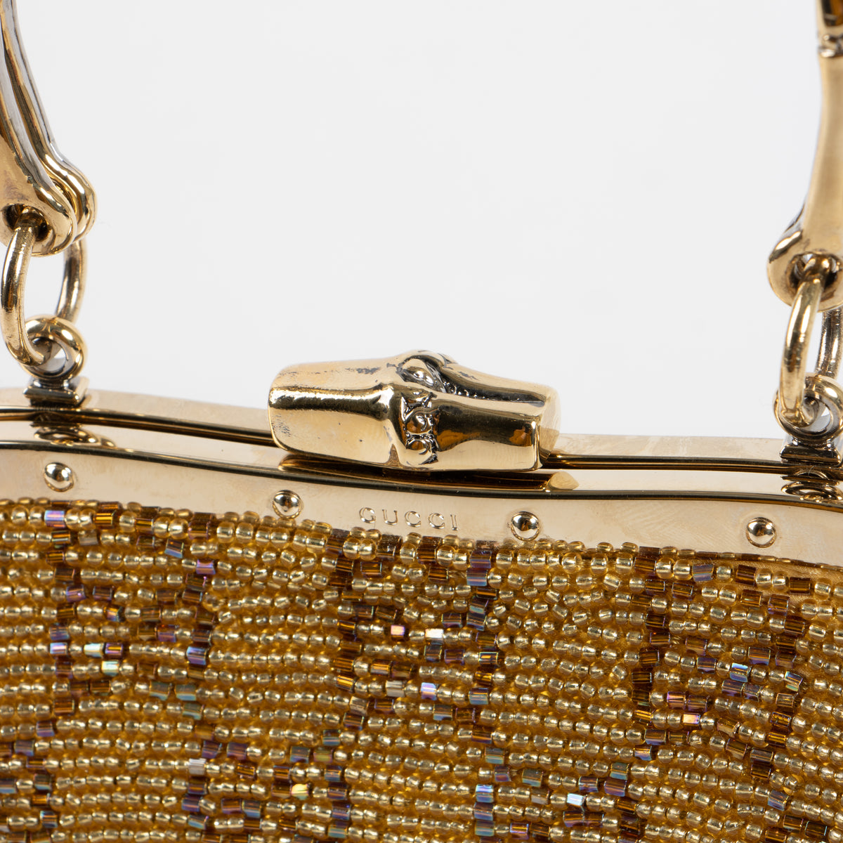 Shop this authentic Gucci Gold Beaded GG Frame Clutch pre-loved on Labellov.com