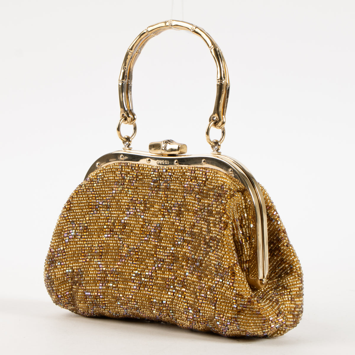 Shop this authentic Gucci Gold Beaded GG Frame Clutch pre-loved on Labellov.com