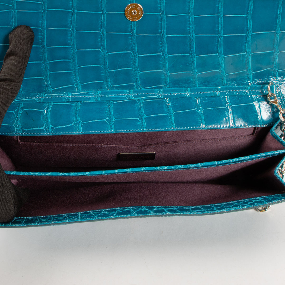 Shop this authentic Judith Leiber Blue Shiny Alligator Crystal Criket Clutch Pre-Loved on Labellov.com