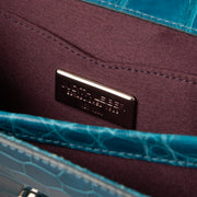 Shop this authentic Judith Leiber Blue Shiny Alligator Crystal Criket Clutch Pre-Loved on Labellov.com
