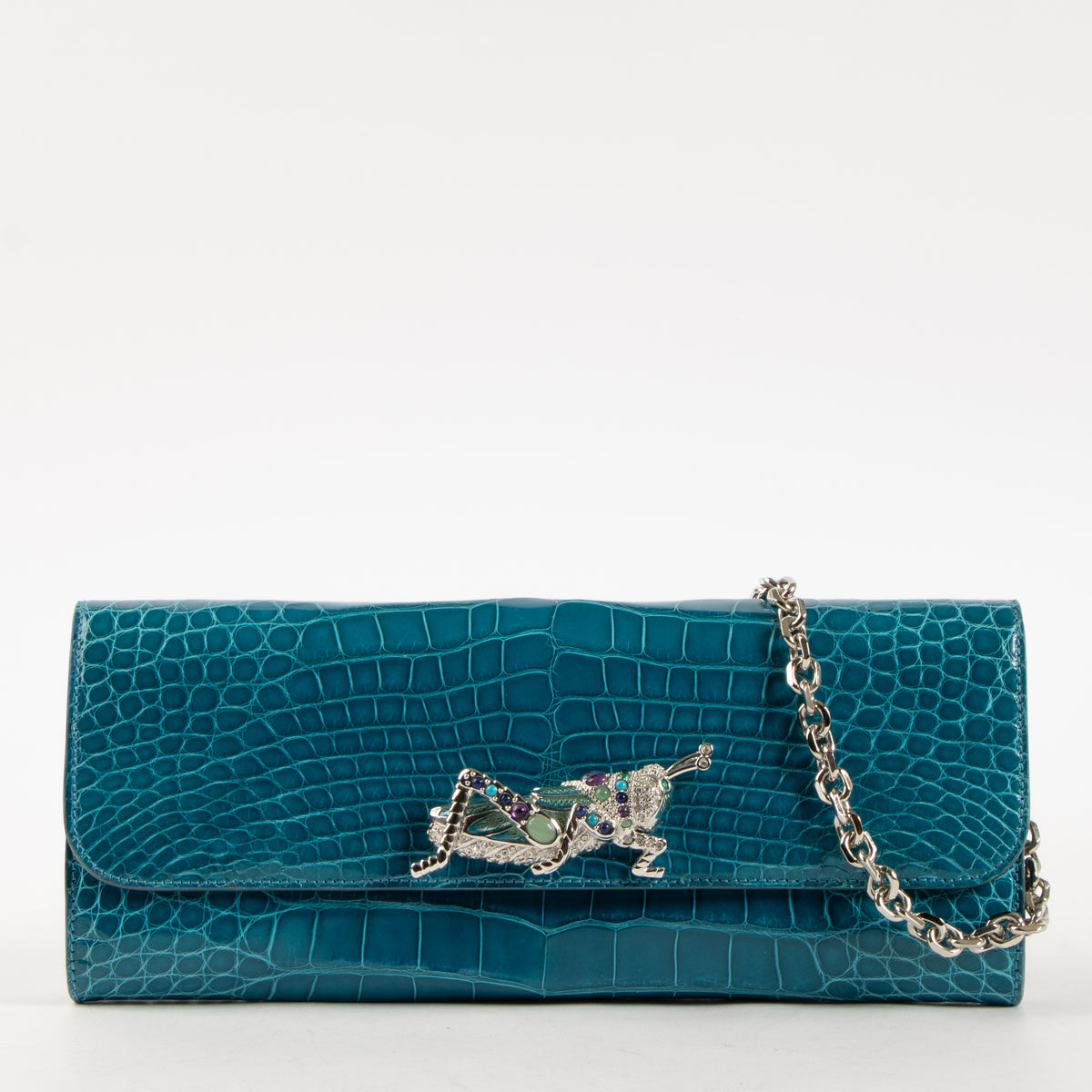 Shop this authentic Judith Leiber Blue Shiny Alligator Crystal Criket Clutch Pre-Loved on Labellov.com