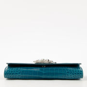 Shop this authentic Judith Leiber Blue Shiny Alligator Crystal Criket Clutch Pre-Loved on Labellov.com