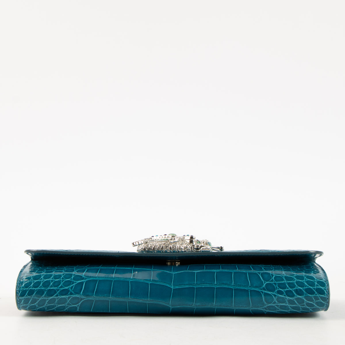 Shop this authentic Judith Leiber Blue Shiny Alligator Crystal Criket Clutch Pre-Loved on Labellov.com