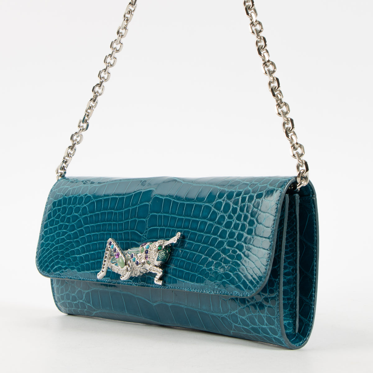 Shop this authentic Judith Leiber Blue Shiny Alligator Crystal Criket Clutch Pre-Loved on Labellov.com