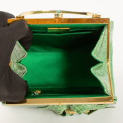 Shop this authentic Judith Leiber Green Shiny Alligator Frame Clutch Pre-Loved on Labellov.com