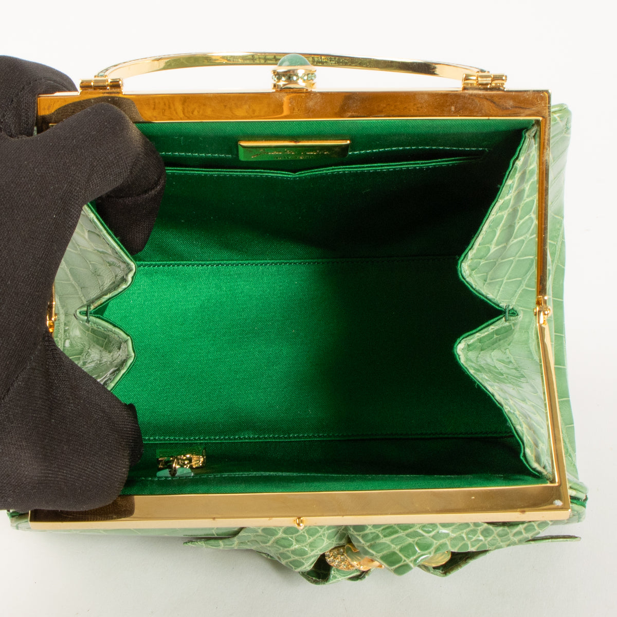 Shop this authentic Judith Leiber Green Shiny Alligator Frame Clutch Pre-Loved on Labellov.com