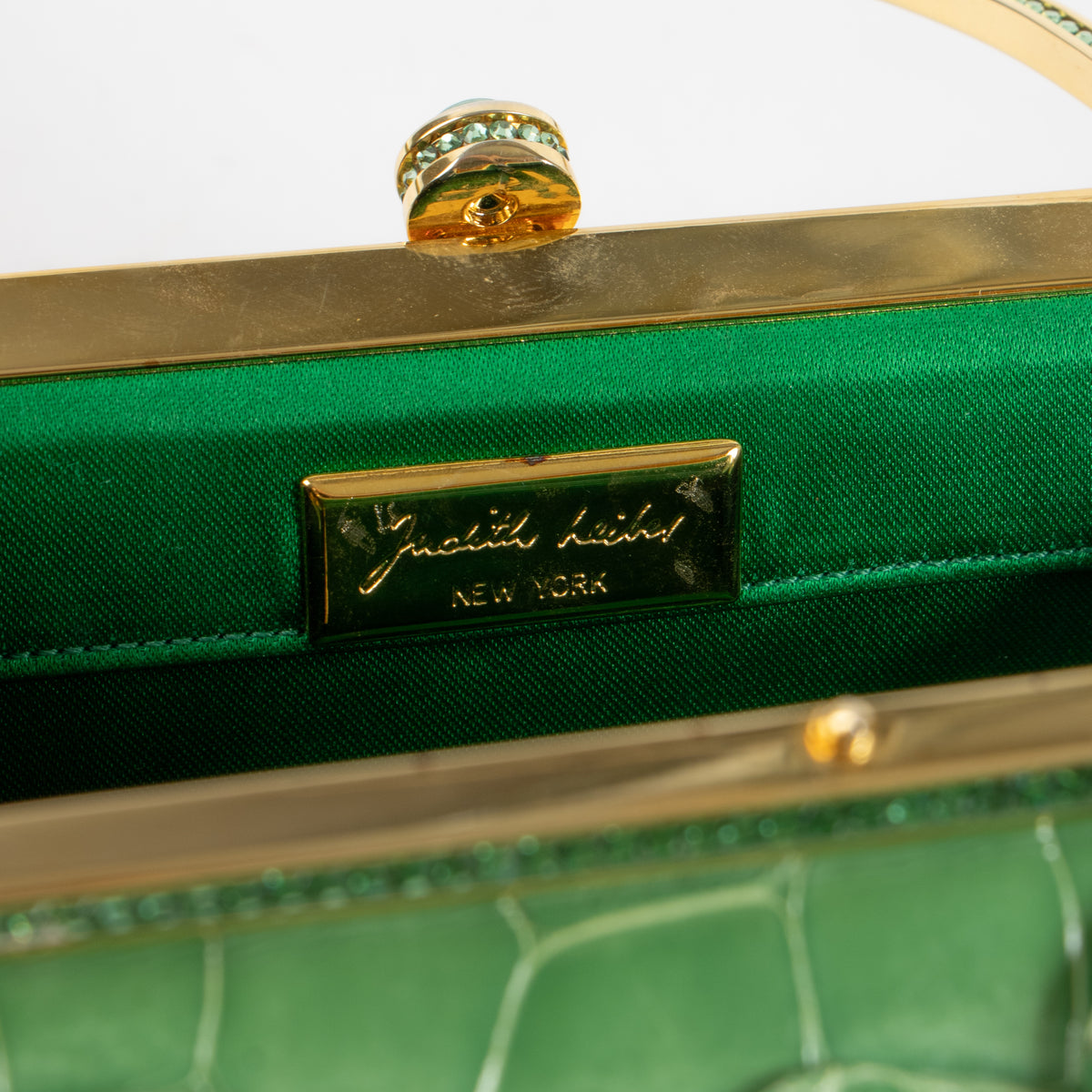 Shop this authentic Judith Leiber Green Shiny Alligator Frame Clutch Pre-Loved on Labellov.com