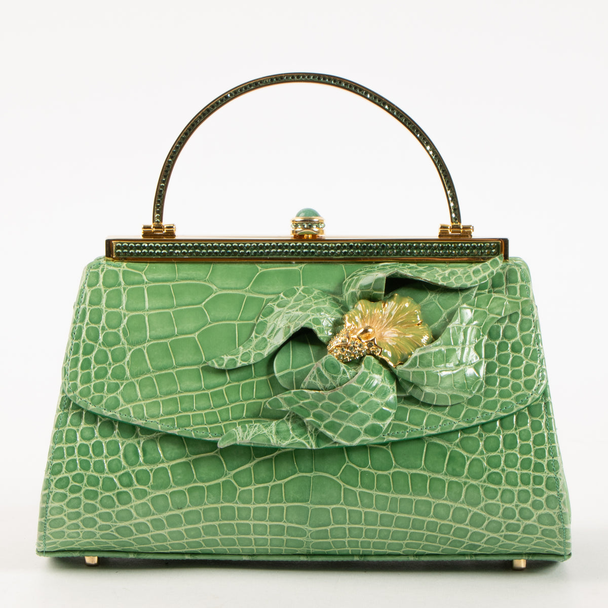 Shop this authentic Judith Leiber Green Shiny Alligator Frame Clutch Pre-Loved on Labellov.com