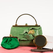 Shop this authentic Judith Leiber Green Shiny Alligator Frame Clutch Pre-Loved on Labellov.com