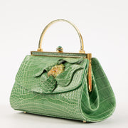 Shop this authentic Judith Leiber Green Shiny Alligator Frame Clutch Pre-Loved on Labellov.com