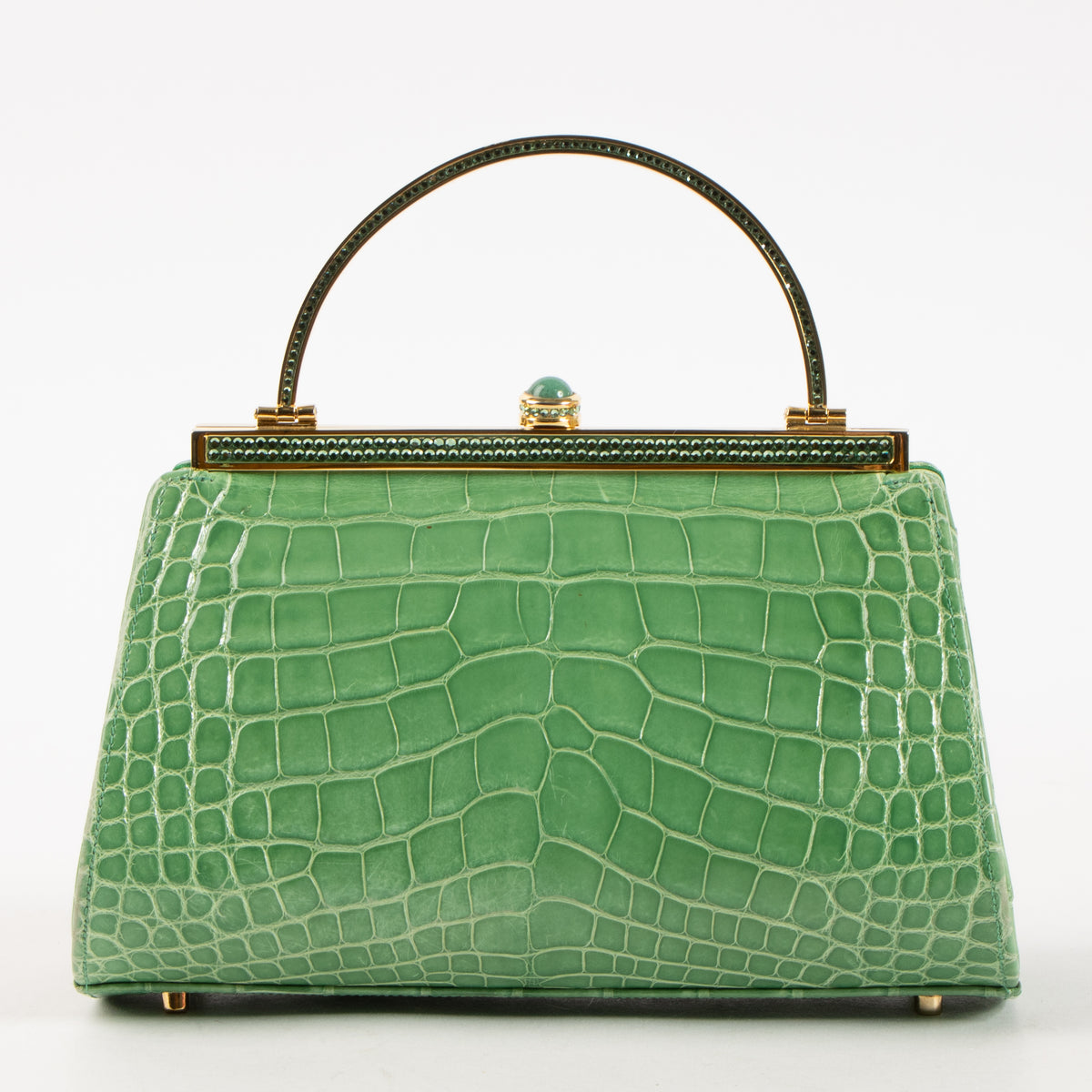 Shop this authentic Judith Leiber Green Shiny Alligator Frame Clutch Pre-Loved on Labellov.com