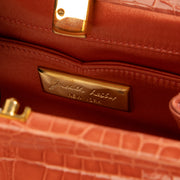 Shop this authentic Judith Leiber Old Rose Shiny Alligator Frame Clutch Pre-Loved on Labellov.com