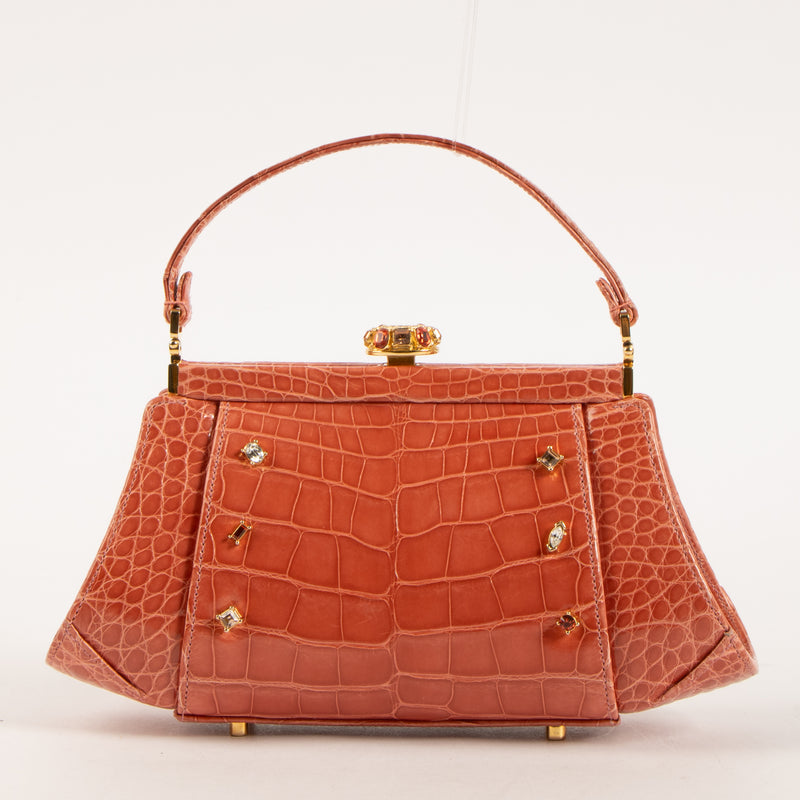 Shop this authentic Judith Leiber Old Rose Shiny Alligator Frame Clutch Pre-Loved on Labellov.com