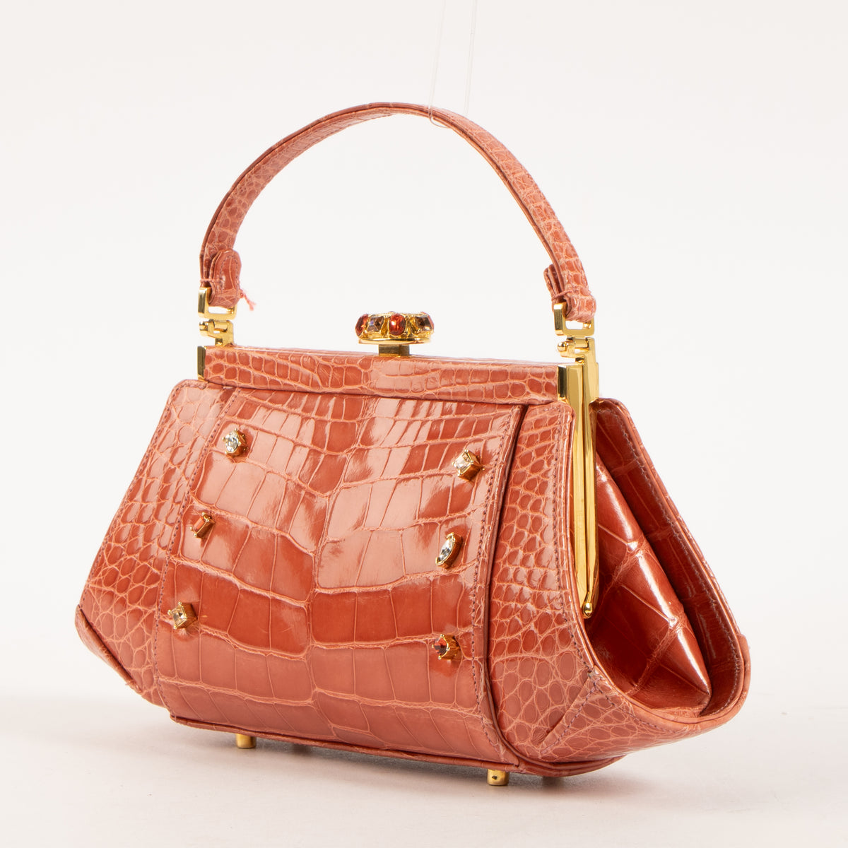 Shop this authentic Judith Leiber Old Rose Shiny Alligator Frame Clutch Pre-Loved on Labellov.com