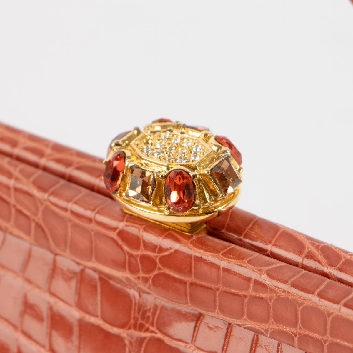 Shop this authentic Judith Leiber Old Rose Shiny Alligator Frame Clutch Pre-Loved on Labellov.com
