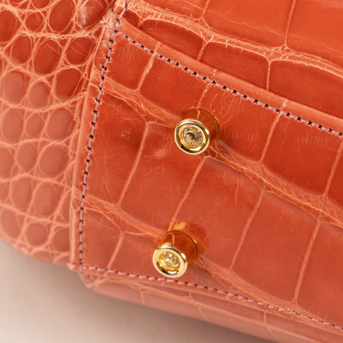Shop this authentic Judith Leiber Old Rose Shiny Alligator Frame Clutch Pre-Loved on Labellov.com