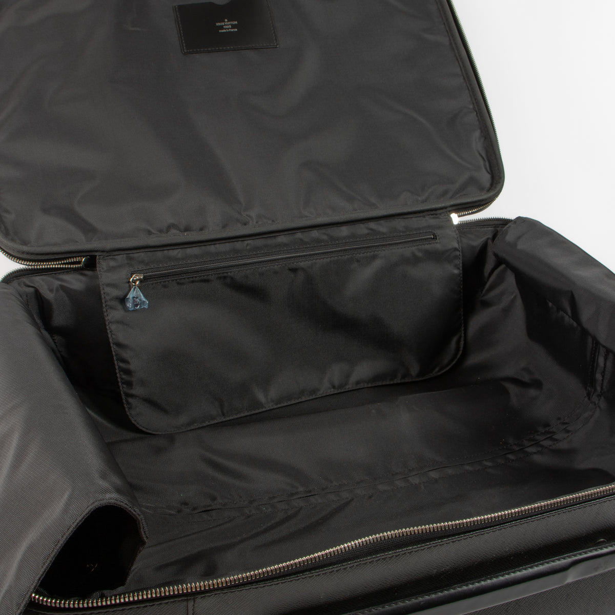 Shop this authentic Louis Vuitton black Taiga Rolling Luggage pre-loved on Labellov.com