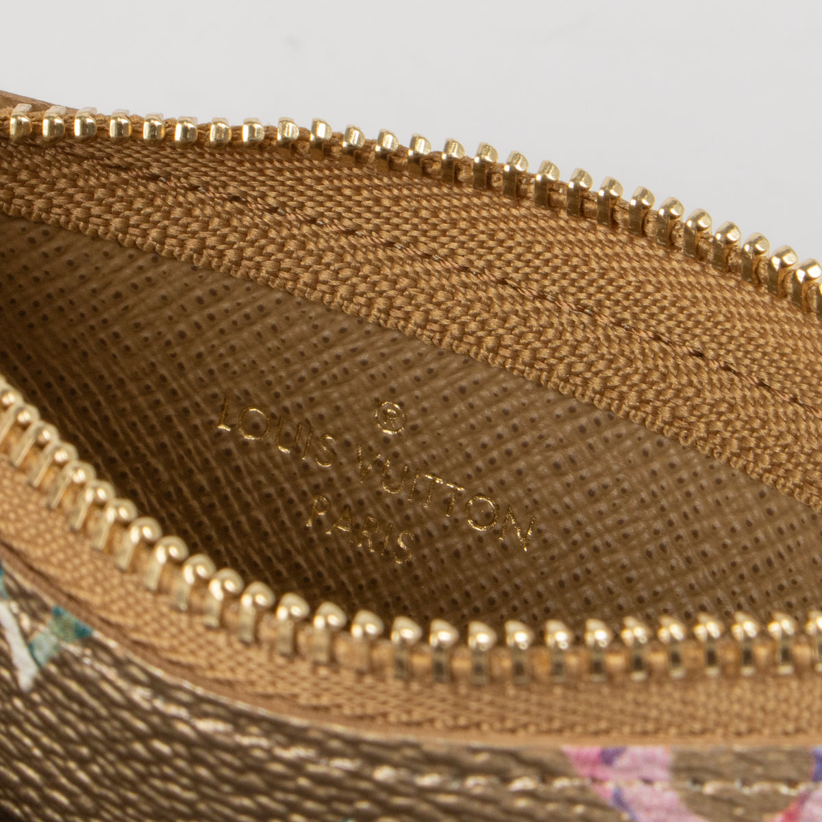 Shop this authentic Louis Vuitton Gold Monogram Garden Key Pouch pre-loved on Labellov.com