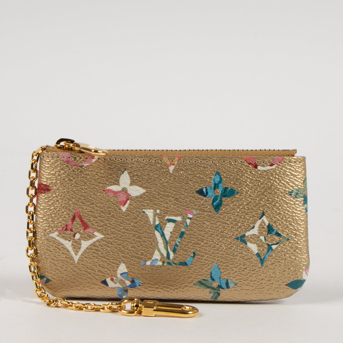 Shop this authentic Louis Vuitton Gold Monogram Garden Key Pouch pre-loved on Labellov.com