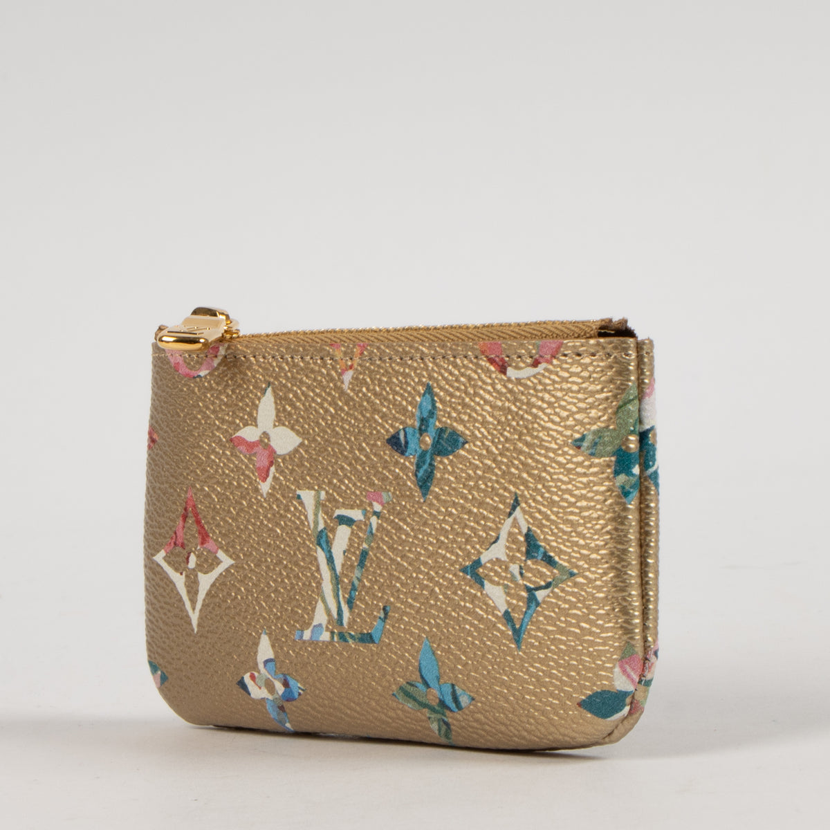Shop this authentic Louis Vuitton Gold Monogram Garden Key Pouch pre-loved on Labellov.com