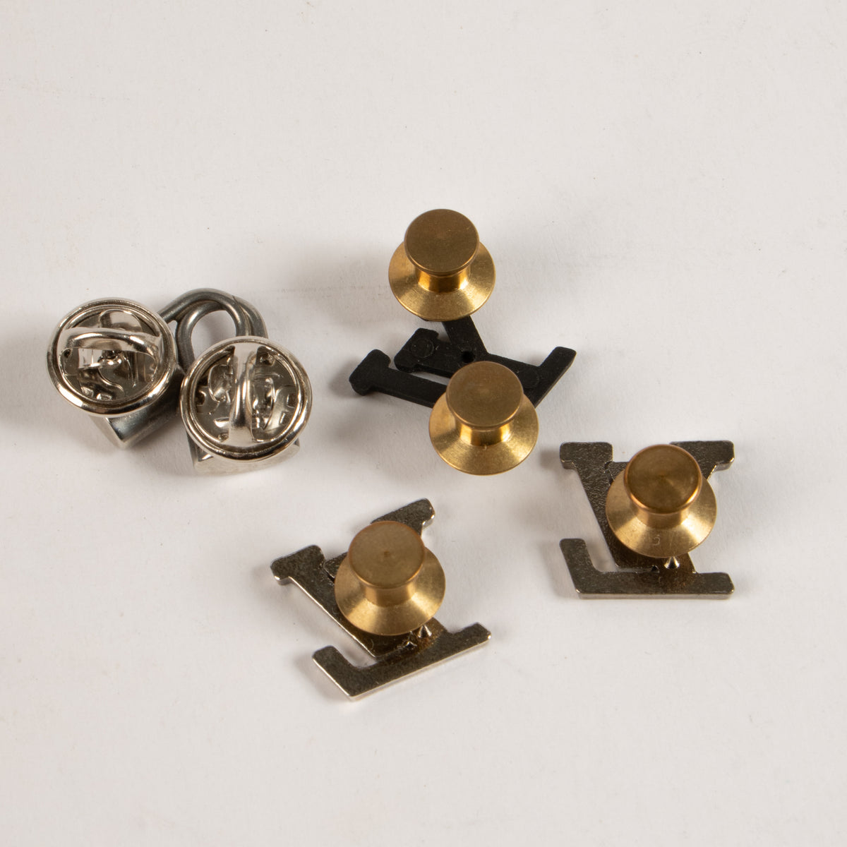Shop this authentic Louis Vuitton Set of 2 Clips and 4 Pins pre-loved on Labellov.com