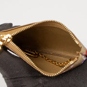 Shop this authentic Louis Vuitton Gold Monogram Garden Key Pouch pre-loved on Labellov.com
