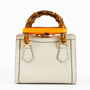 Shop this authentic Gucci Beige Leather Diana Small Tote Bag pre-loved on Labellov.com