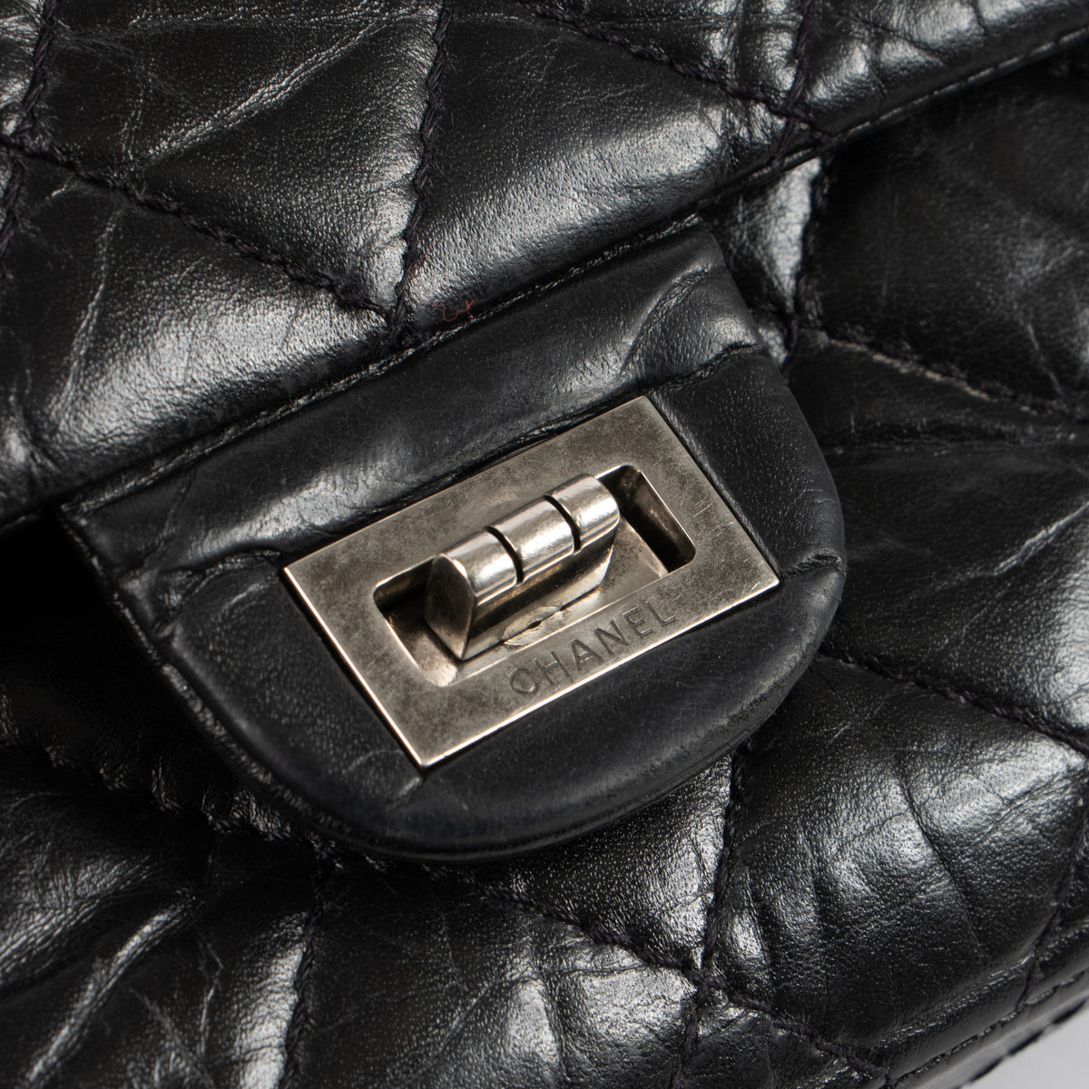 Shop this authentic Chanel Black Aged Calfskin Large Reissue 2.55 Bag pre-loved on Labellov.com