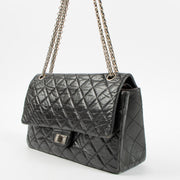 Shop this authentic Chanel Black Aged Calfskin Large Reissue 2.55 Bag pre-loved on Labellov.com